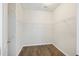 Empty walk-in closet with hardwood floors, white walls, and metal shelving offers ample storage at 422 Switchgrass Dr, Summerville, SC 29486