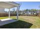 Well-maintained backyard featuring a covered patio and view of the neighborhood at 455 Minim St, Charleston, SC 29414