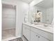 Bathroom featuring dual sinks, white cabinetry, and a view into the walk-in closet at 455 Minim St, Charleston, SC 29414