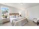 Bright bedroom featuring neutral carpet, a large window, and ensuite bath access at 455 Minim St, Charleston, SC 29414