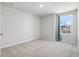 Bright bedroom with neutral carpet and a window, offering a serene retreat at 455 Minim St, Charleston, SC 29414