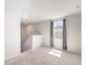 Upstairs flex room with neutral carpet and a window providing natural light at 455 Minim St, Charleston, SC 29414