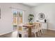 Dining room with modern table set and sliding glass door to backyard at 455 Minim St, Charleston, SC 29414
