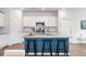Spacious kitchen island with seating and white cabinetry, perfect for cooking and entertaining at 455 Minim St, Charleston, SC 29414