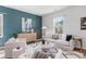 Comfortable living room featuring neutral furniture, an accent wall and abundant natural light at 455 Minim St, Charleston, SC 29414