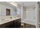 Bathroom featuring double sink vanity with dark cabinetry and combination shower and tub at 491 Fox Sparrow Ct, Summerville, SC 29486