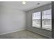 Bright bedroom featuring carpet floors, two windows with horizontal blinds allowing natural light at 491 Fox Sparrow Ct, Summerville, SC 29486