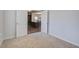 View from the bedroom to the kitchen and dining area through double doors, carpet flooring at 491 Fox Sparrow Ct, Summerville, SC 29486