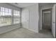 Bedroom with carpet, a door, a closet and two windows at 491 Fox Sparrow Ct, Summerville, SC 29486