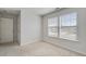 A bright bedroom featuring large windows for natural light and plush carpeting at 491 Fox Sparrow Ct, Summerville, SC 29486