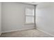 Bright bedroom with a window offering natural light and neutral carpeting throughout at 491 Fox Sparrow Ct, Summerville, SC 29486