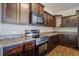 View of the kitchen with stainless steel oven and microwave, and wooden cabinets at 491 Fox Sparrow Ct, Summerville, SC 29486