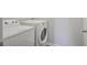 The laundry room includes a white washer and dryer set against a neutral wall at 491 Fox Sparrow Ct, Summerville, SC 29486