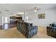 Spacious living room with neutral walls, carpet flooring, and comfortable dark-colored sofa seating at 491 Fox Sparrow Ct, Summerville, SC 29486