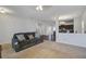 Open-concept living space with cozy seating area flowing into the kitchen, and dining area at 491 Fox Sparrow Ct, Summerville, SC 29486