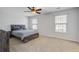 Bright main bedroom with modern bed frame, ceiling fan, and abundant natural light at 491 Fox Sparrow Ct, Summerville, SC 29486