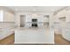 Bright, open kitchen featuring white cabinets, a center island, and modern stainless steel appliances at 509 Verdi Dr, Summerville, SC 29486