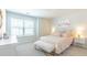 Bright bedroom featuring plush carpet, flamingo art, and stylish accent lamps at 509 Yukon Ct, Lincolnville, SC 29485