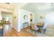Bright dining room with hardwood floors, a wooden table, and stylish decor at 509 Yukon Ct, Lincolnville, SC 29485