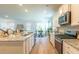 Bright, modern kitchen with stainless steel appliances, granite countertops, and an open floor plan at 509 Yukon Ct, Lincolnville, SC 29485