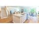 Open floor plan featuring an open kitchen, barstool seating, dining, and living space at 509 Yukon Ct, Lincolnville, SC 29485