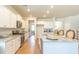 Open kitchen with granite countertops, stainless steel appliances, and barstool seating at 509 Yukon Ct, Lincolnville, SC 29485