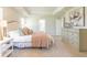 Spacious main bedroom features neutral tones, tray ceilings, and lots of natural light at 509 Yukon Ct, Lincolnville, SC 29485