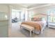 Bright main bedroom with a neutral palette, walk-in closet, and adjacent office area at 509 Yukon Ct, Lincolnville, SC 29485