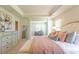 A spacious main bedroom featuring tray ceilings, a walk-in closet, and natural light at 509 Yukon Ct, Lincolnville, SC 29485