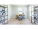 Bright home office features large windows, lots of light, and built-in shelves at 509 Yukon Ct, Lincolnville, SC 29485