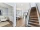 Inviting entryway with hardwood floors, a staircase, and an adjacent sitting room featuring stylish decor at 517 Verdi Dr, Summerville, SC 29486