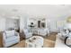 Open-concept living space with a kitchen island, dining area, and stylish furniture arrangement at 517 Verdi Dr, Summerville, SC 29486