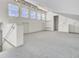 Attic space with carpeted flooring, built-in storage, and natural light, featuring an adjacent bathroom space at 649 Pawley Rd, Mount Pleasant, SC 29464