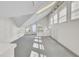 Bright attic space with built-in storage, carpet flooring, and natural light from large windows and door at 649 Pawley Rd, Mount Pleasant, SC 29464