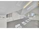 Attic space features carpeted flooring, built-in storage cabinets and drawers, and plenty of natural light at 649 Pawley Rd, Mount Pleasant, SC 29464