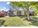Spacious backyard featuring a home exterior with deck, stairs, green grass, and foliage at 649 Pawley Rd, Mount Pleasant, SC 29464