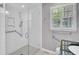 Modern bathroom featuring a frameless glass shower, subway tile, and a window for natural light at 649 Pawley Rd, Mount Pleasant, SC 29464