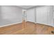 Spacious bedroom featuring gleaming hardwood floors, neutral walls, and ample closet space at 649 Pawley Rd, Mount Pleasant, SC 29464