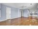 Spacious bedroom featuring light blue walls, hardwood floors, ceiling fan, and ensuite kitchenette at 649 Pawley Rd, Mount Pleasant, SC 29464
