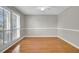 Light-filled bedroom with hardwood floors, ceiling fan and ample natural light at 649 Pawley Rd, Mount Pleasant, SC 29464