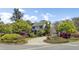 Charming home featuring a lush landscaped yard with beautiful blooming azaleas at 649 Pawley Rd, Mount Pleasant, SC 29464