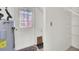 Garage entryway with water heater and shelving at 649 Pawley Rd, Mount Pleasant, SC 29464