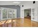 Bright living room featuring hardwood floors, fireplace, and large sliding glass doors to the outside deck at 649 Pawley Rd, Mount Pleasant, SC 29464