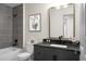 Stylish bathroom featuring a shower and tub combination, paired with modern dark fixtures and a sleek vanity at 7120 Sweetgrass Blvd, Hanahan, SC 29410