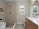 Modern bathroom with walk-in shower, dual vanities, soaking tub, and contemporary fixtures at 7120 Sweetgrass Blvd, Hanahan, SC 29410