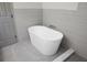 Relaxing bathroom featuring a modern soaking tub, stylish fixtures, and elegant tile work at 7120 Sweetgrass Blvd, Hanahan, SC 29410