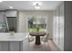 Eat-in kitchen with stainless steel appliances and gray cabinets, perfect for casual dining and meal prep at 7120 Sweetgrass Blvd, Hanahan, SC 29410