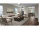 Bright living room with hardwood floors and natural light, seamlessly connected to the dining area at 7120 Sweetgrass Blvd, Hanahan, SC 29410
