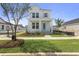 Charming two-story home with a quaint front porch and beautiful landscaping at 713 Rumbling Leaf Ln, Summerville, SC 29486