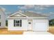 Charming single-story home with a white exterior and a one-car garage at 722 Long Bluff Rd, Summerville, SC 29486